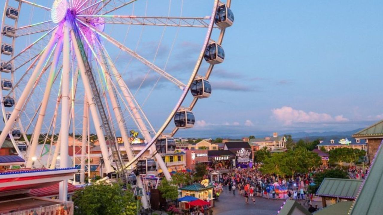 A scenic view of Pigeon Forge with mountains in the background, highlighting popular attractions.