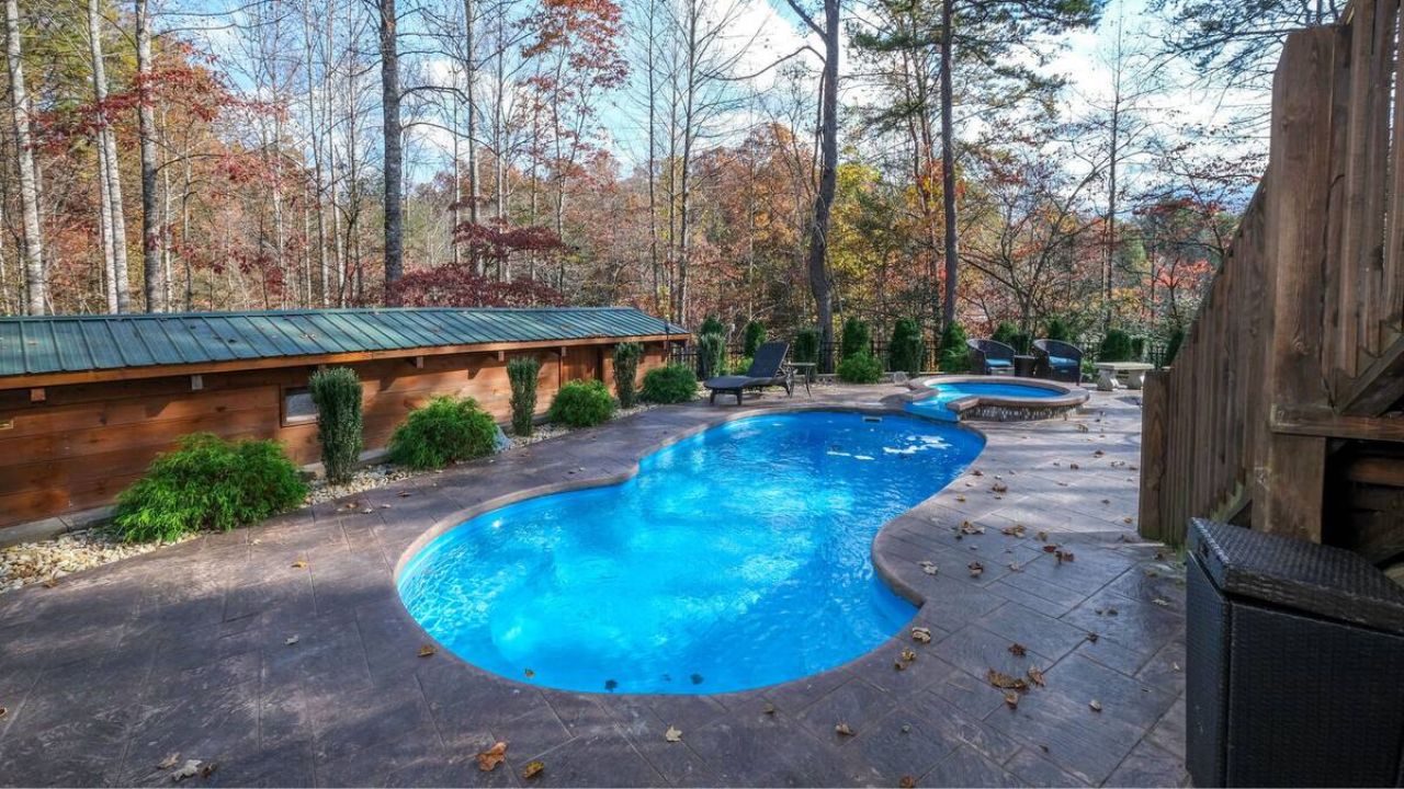 A luxurious swimming pool at a cabin, perfect for cooling off during a summer vacation.