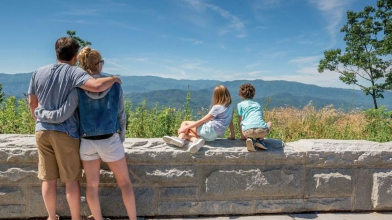 Spending 48 Hours in Pigeon Forge A couple exploring a scenic hiking trail near Pigeon Forge.